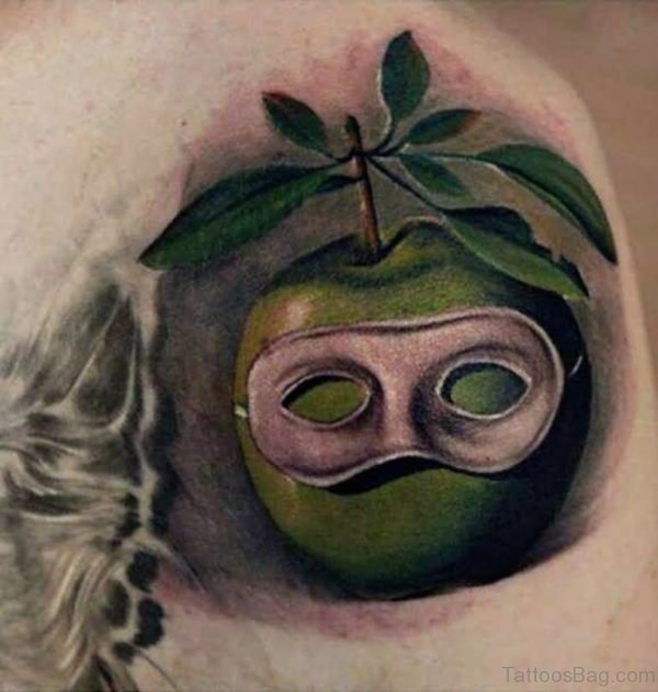 Amazing Green Apple Mask Tattoo On Shoulder