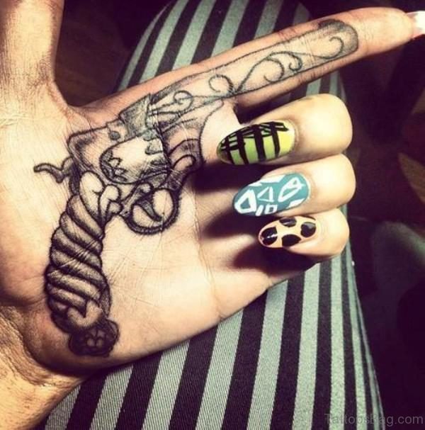 Amazing Gun Tattoo On Finger