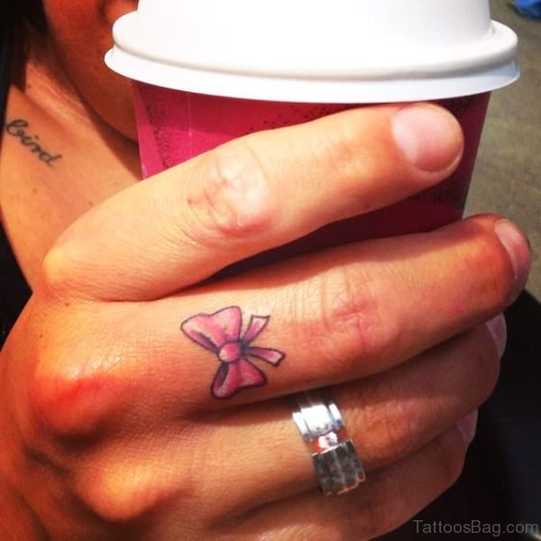 Amazing Pink Bow Tattoo On Finger