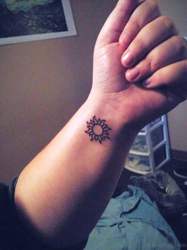Amazing Sun Tattoo On Wrist 