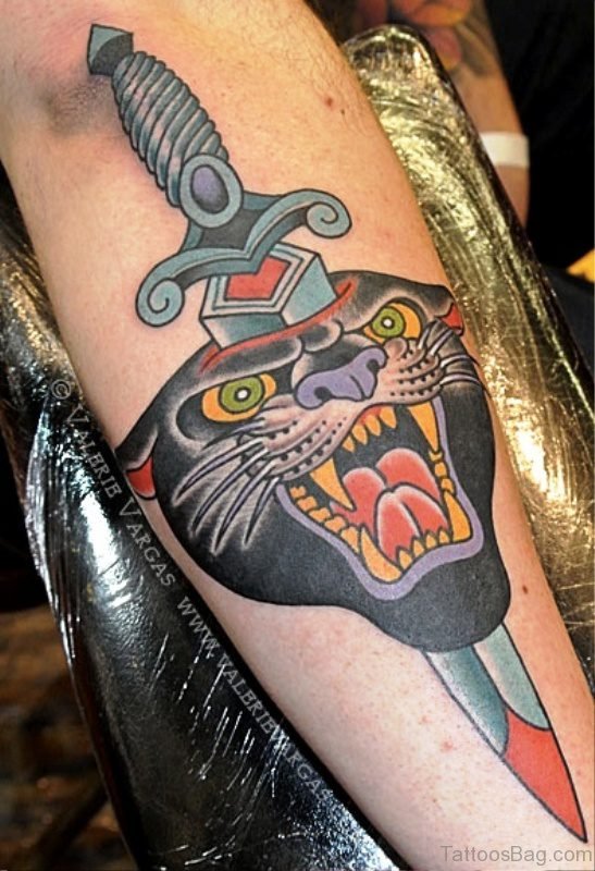 Angry Panther Tattoo With Dagger On Arm