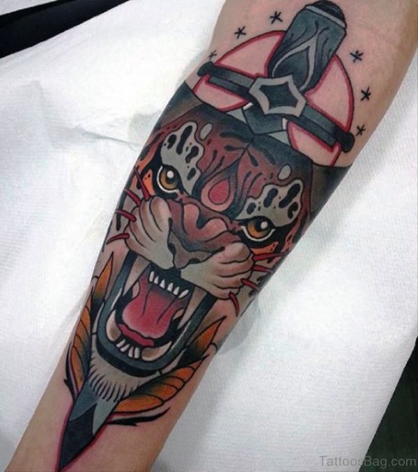 Angry Tiger With Dagger Tattoo On Arm