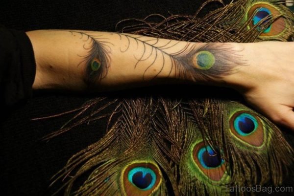 Attractive Peacock Feather Wrist Tattoo