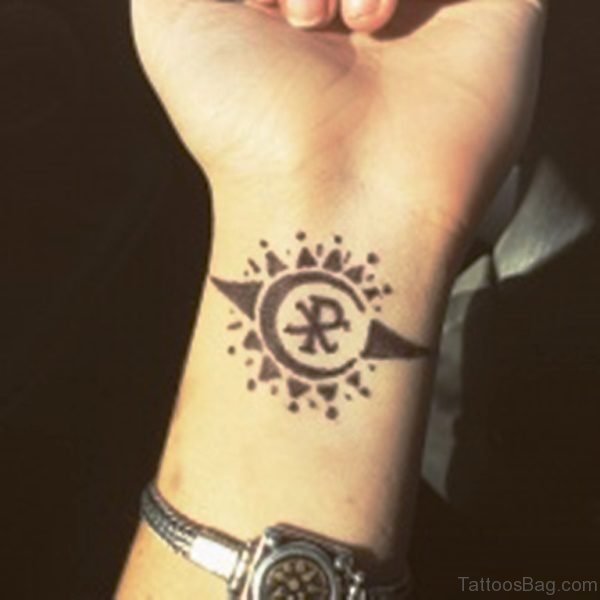 Attractive Sun Tattoo On Wrist 