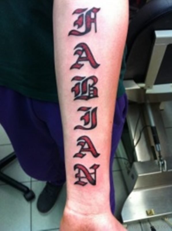 Awesome red colored massive ambigram tattoo on arm