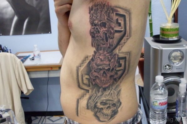 Aztec Skulls Tattoo On Rib Side For Men