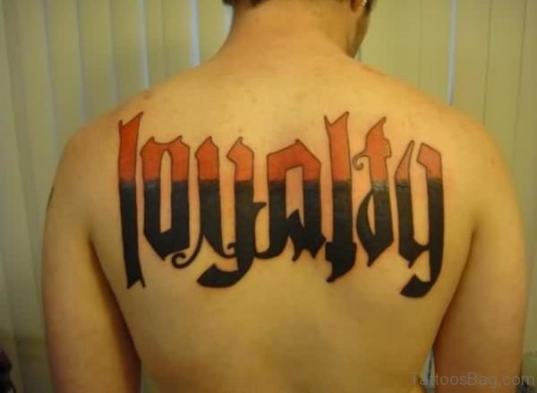 Big Loyalty Ambigram Tattoo On Back