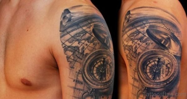 Black And Grey 3D Compass With Map Tattoo On Man Left Shoulder