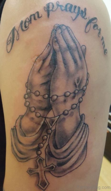 Black And Grey Christian Rosary Cross In Praying Hand Tattoo Design For Shoulder