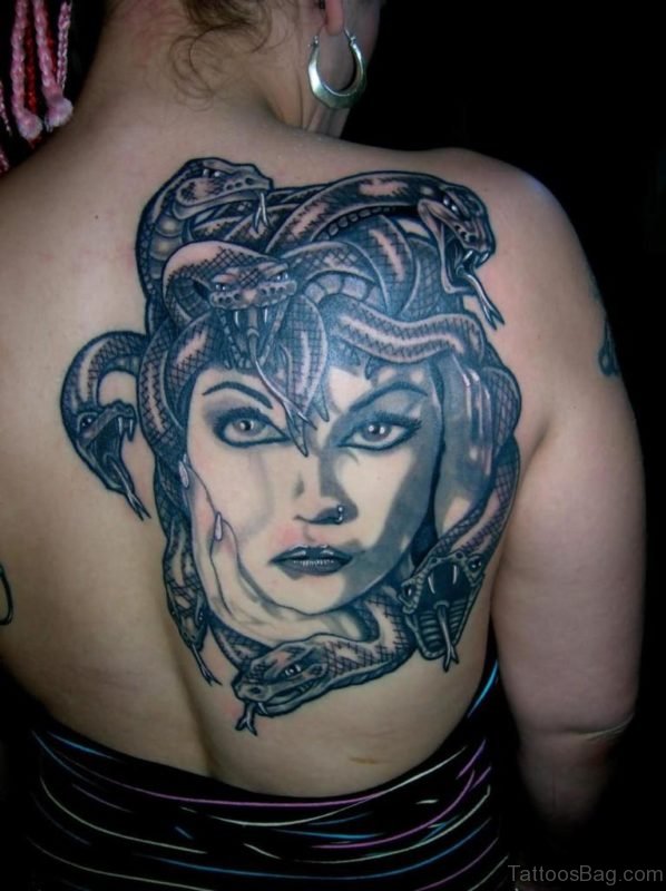 Black And Grey Medusa Face Tattoo On Girl Right Back Shoulder