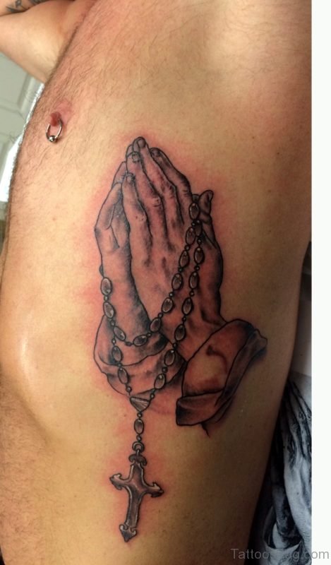 Black And Grey Praying Hands Tattoo On Rib