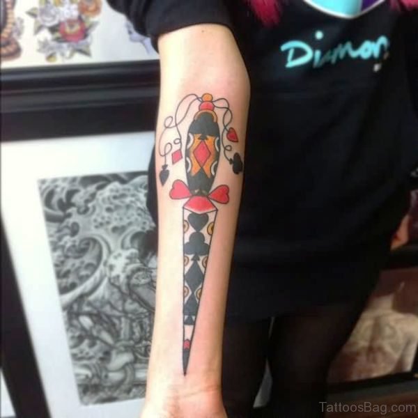Black And Red Dagger Tattoo On Arm
