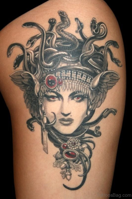 Black And White Medusa Head Tattoo On Thigh