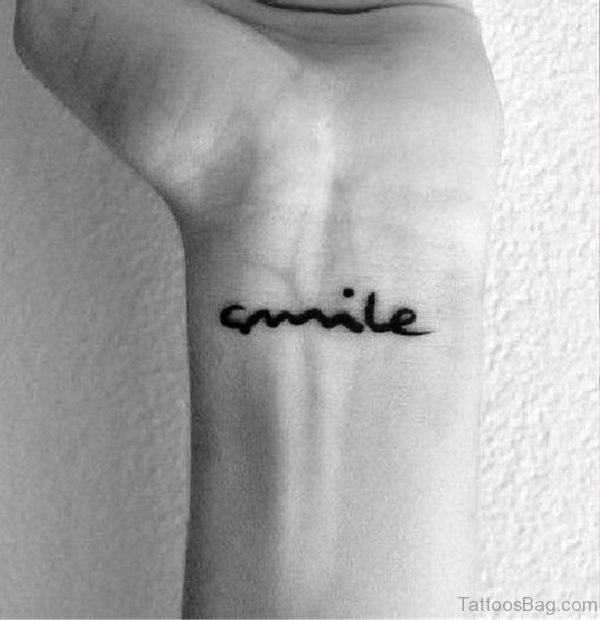 Black And White Smile Wrist Tattoo