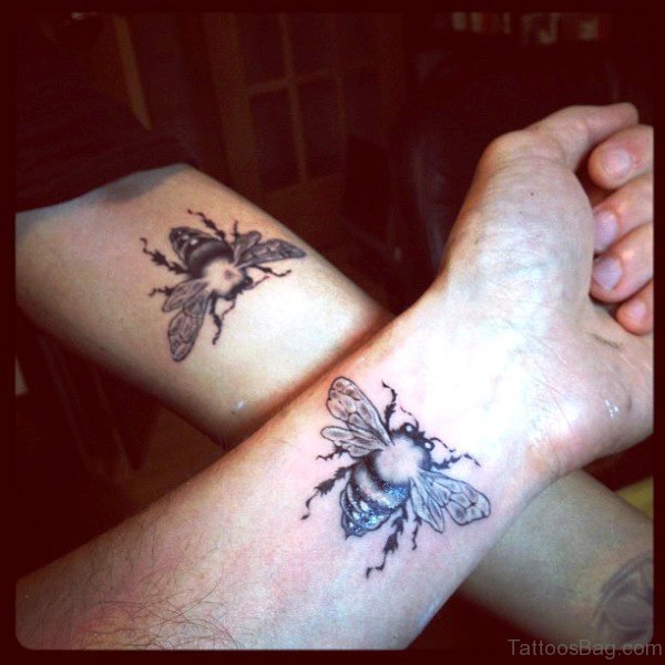 Black Bee Tattoo On Wrist And Arm