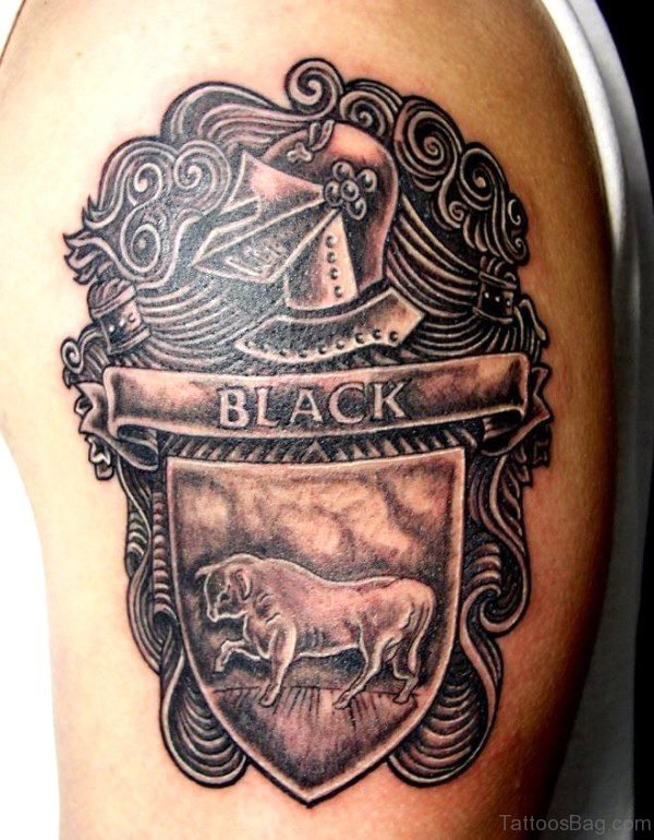 Black Crest Bull Tattoo On Shoulder