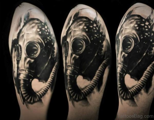 Black Ink Gas Mask Tattoo On Left Shoulder