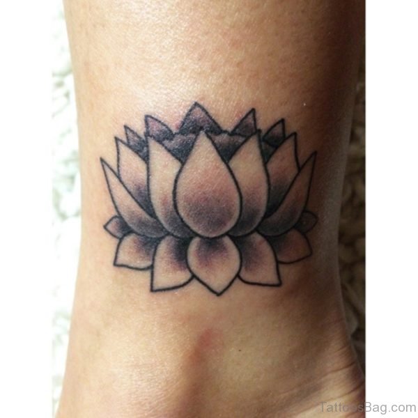 Black Ink Lotus Flower Tattoo Design For Inner Ankle