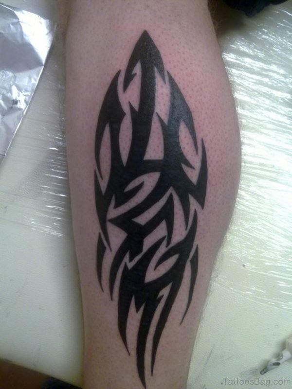 Black Ink Tribal Tattoo Designs On Leg