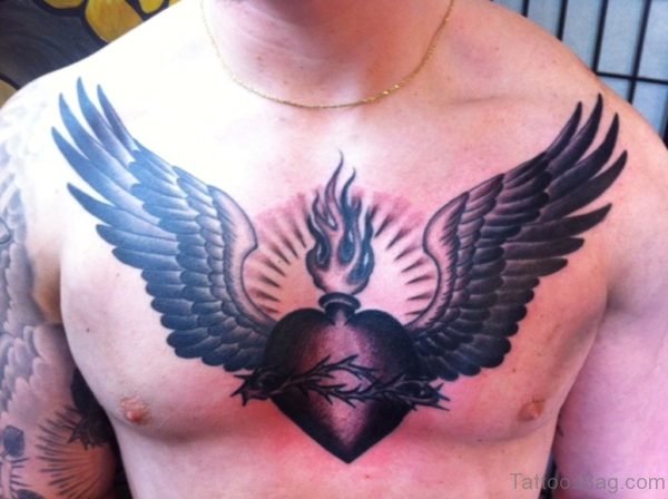 Black Inked Heart Tattoo On Chest