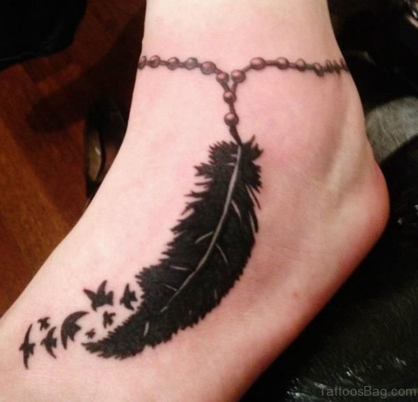 Black Rosary Feather And Flying Birds Tattoo On Ankle