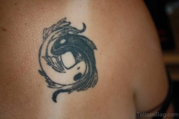 Black Small Koi Fish Tattoo On Chest