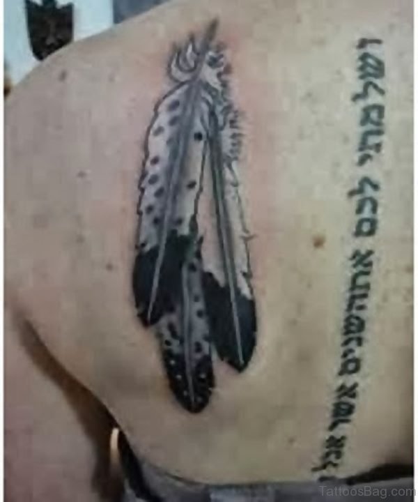 Black Wording And Feather Tattoo On Back