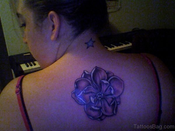 Blacklight Magnolia Tattoo On Upper Back