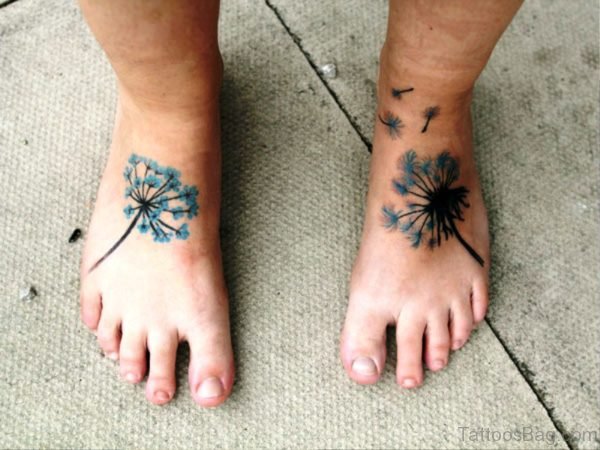 Blue And Black Dandelion Tattoo On Feet
