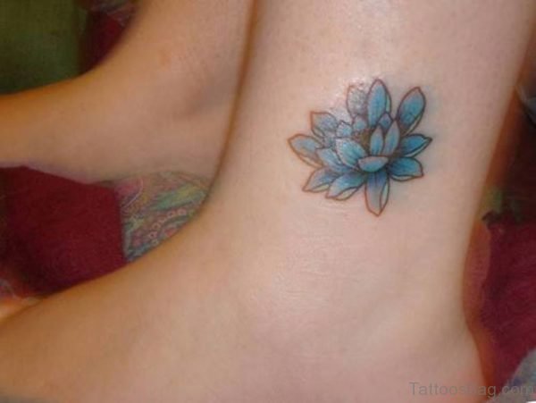 Blue Ink Lotus Flower Tattoo On Ankle