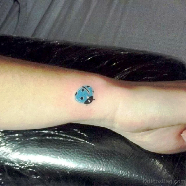 Blue Ladybug Tattoo On Wrist 