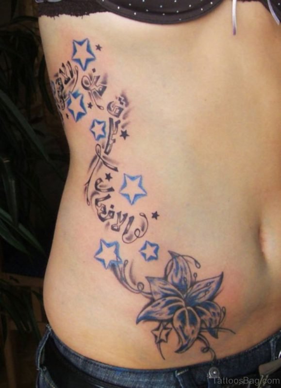 Blue Star Tattoo On Rib