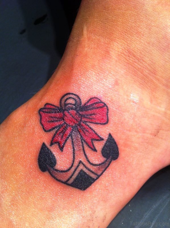 Bow And Anchor Tattoo On Wrist