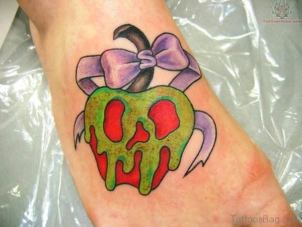 Bow And Apple Tattoo On Foot