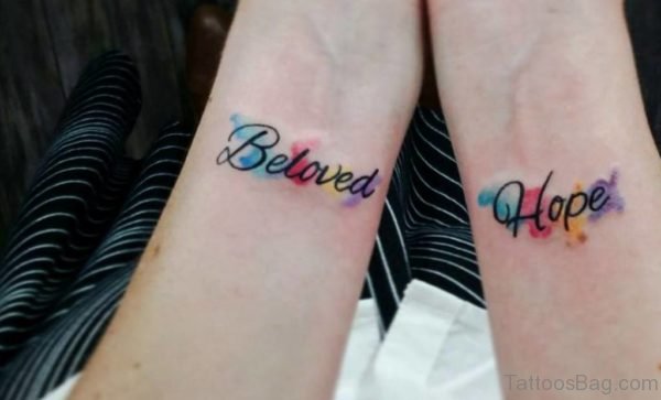 Colored Wording Tattoo On Wrist