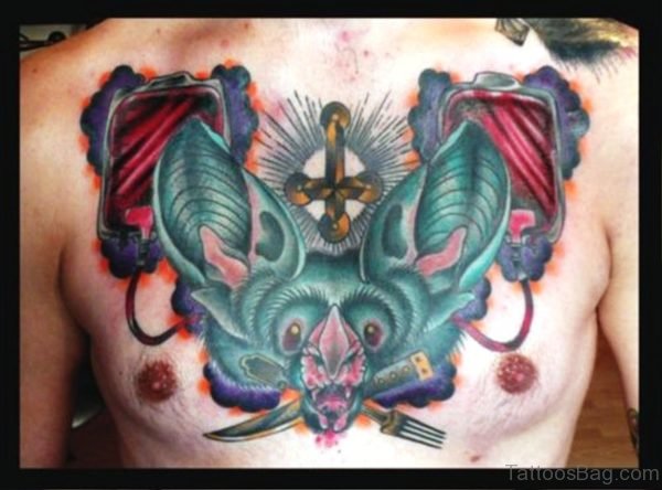 Colorful Bat Tattoo With Cross On Chest
