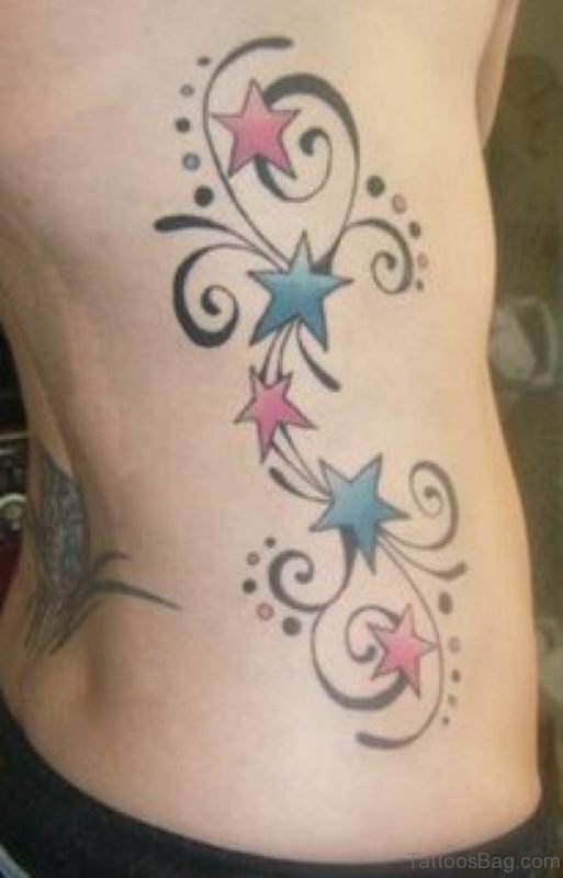 Colorful Star Tattoos On Side Of Rib