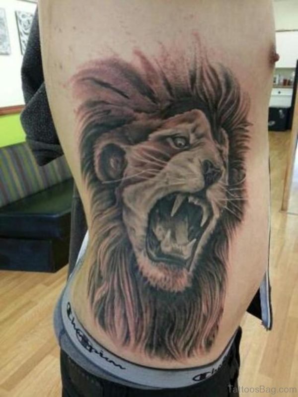 Crawling Lion Tattoo On Rib