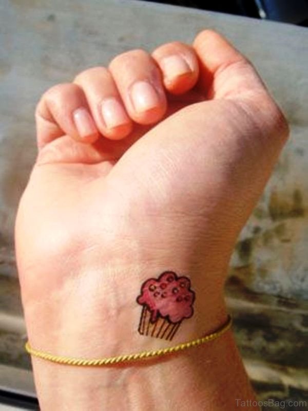 Cute Pink Cupcake Tattoo On Wrist 