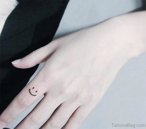 Cute Smile Symbol Tattoo On Finger