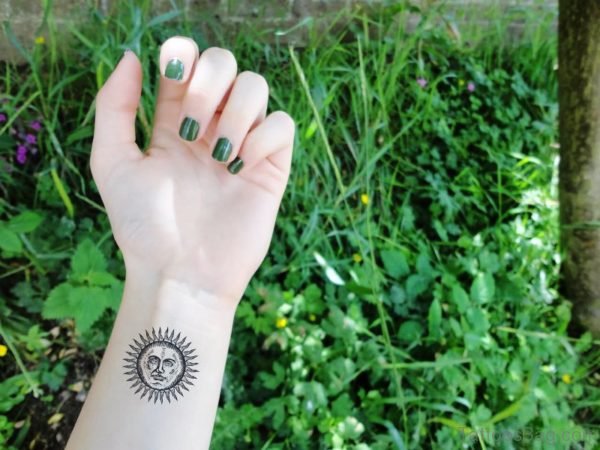 Cute Sun Tattoo On Wrist 