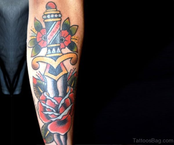 Dagger With Flowers Tattoo On Arm