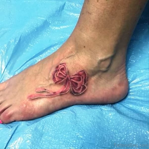 Dazzling Bow Tattoo On Foot