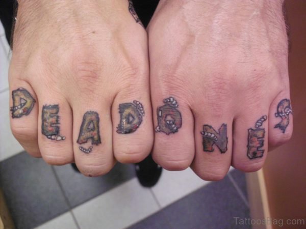 Dead Ones Tattoo On Finger