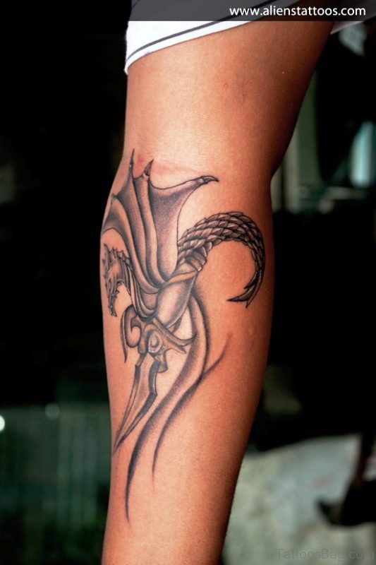 Dragon Holding Dagger Tattoo On Arm