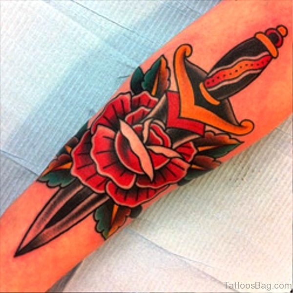 Elegant And Dagger Tattoo On Arm
