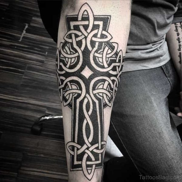 Elegant Cross Tattoo On Arm