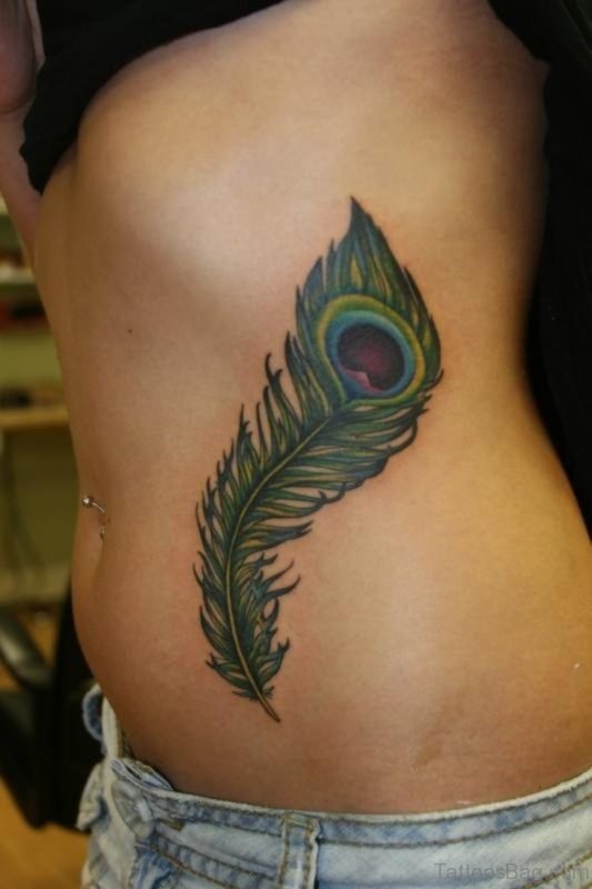 Elegant Peacock Feather Tattoo On Rib