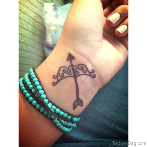 Excellent Cool Bow And Arrow Tattoo On Wris