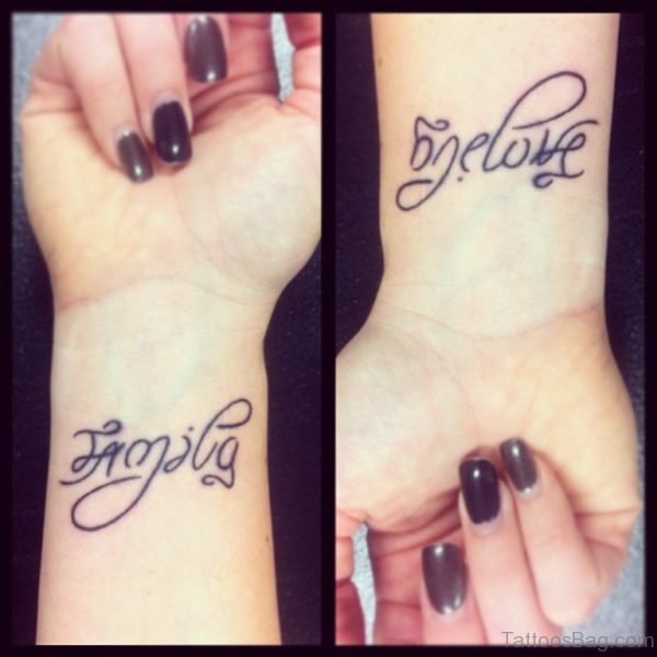 Family Ambigram Tattoo On Girl Wrist